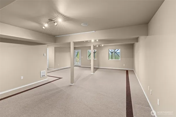 a view of a hallway with closet and a livingroom view