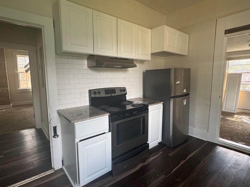 16 29th Street Columbus, GA 31904 - Photo 4 of 12 a kitchen with a stove and a refrigerator