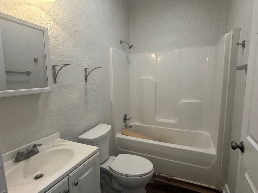 16 29th Street Columbus, GA 31904 - Photo 7 of 12 a bathroom with a sink toilet and shower