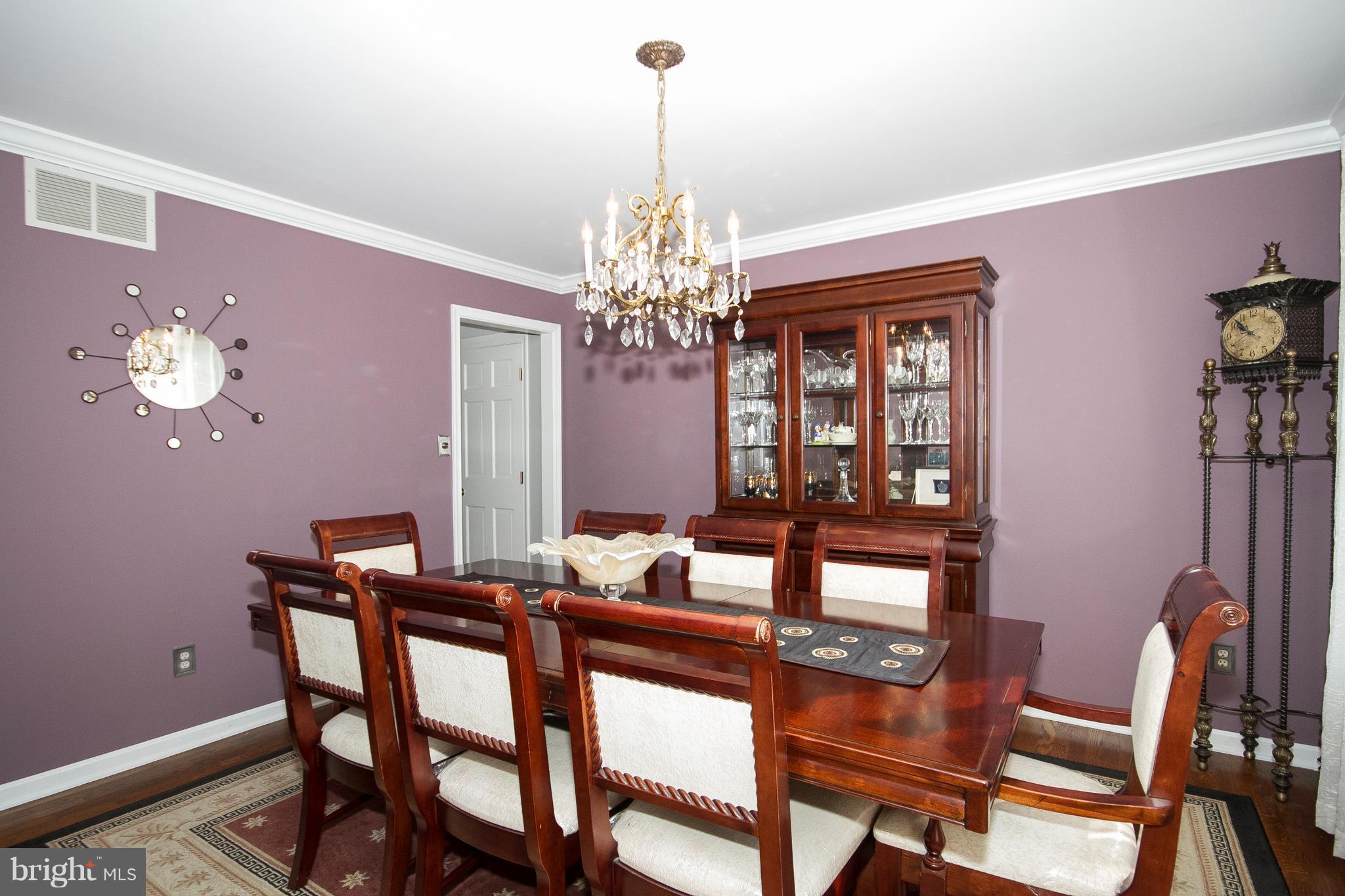 2902 York Manor Road Phoenix, MD 21131 - Photo 4 of 30 a view of a dining room with furniture and chandelier