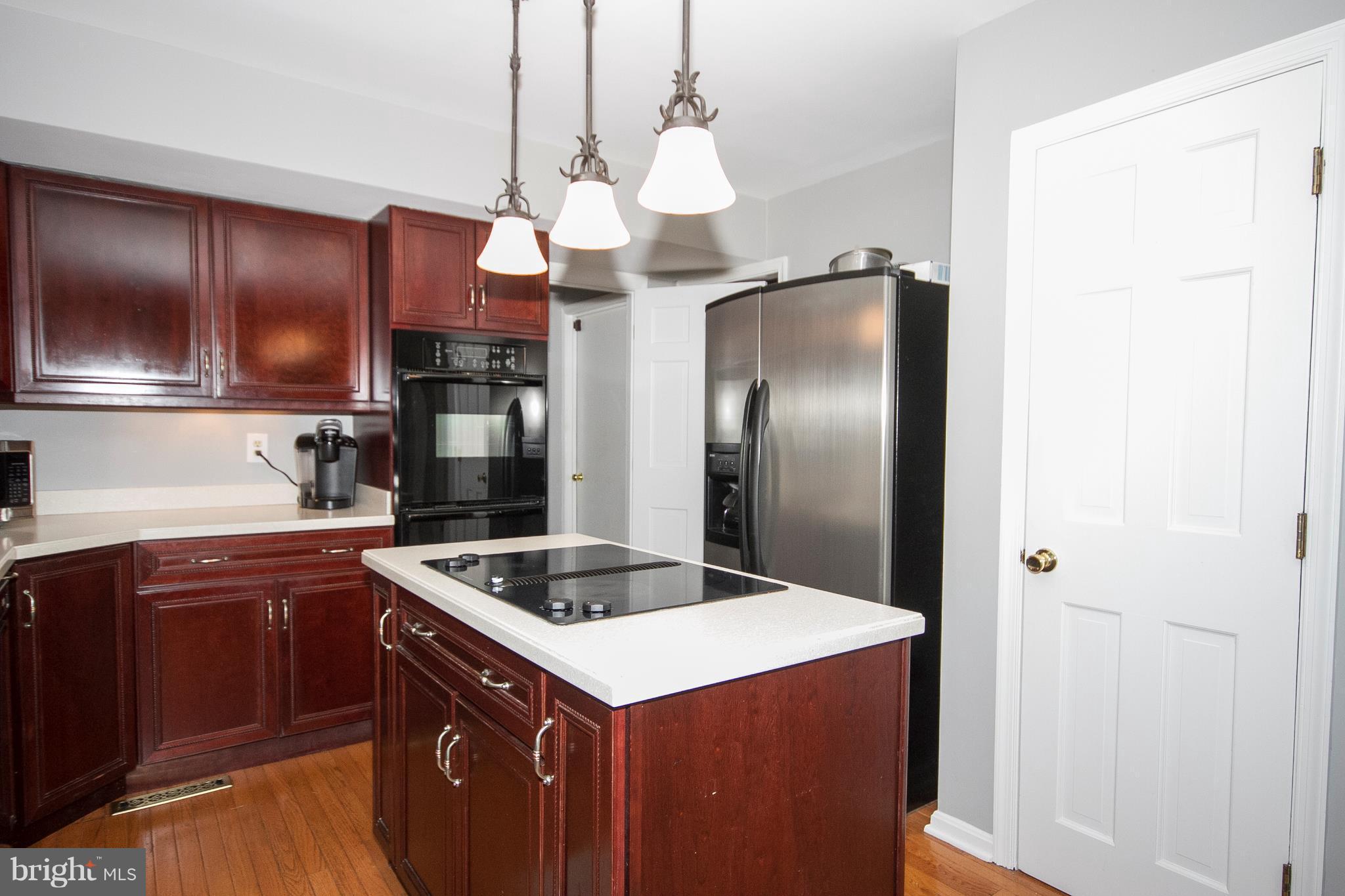 2902 York Manor Road Phoenix, MD 21131 - Photo 5 of 30 a kitchen with stainless steel appliances granite countertop a sink and a refrigerator