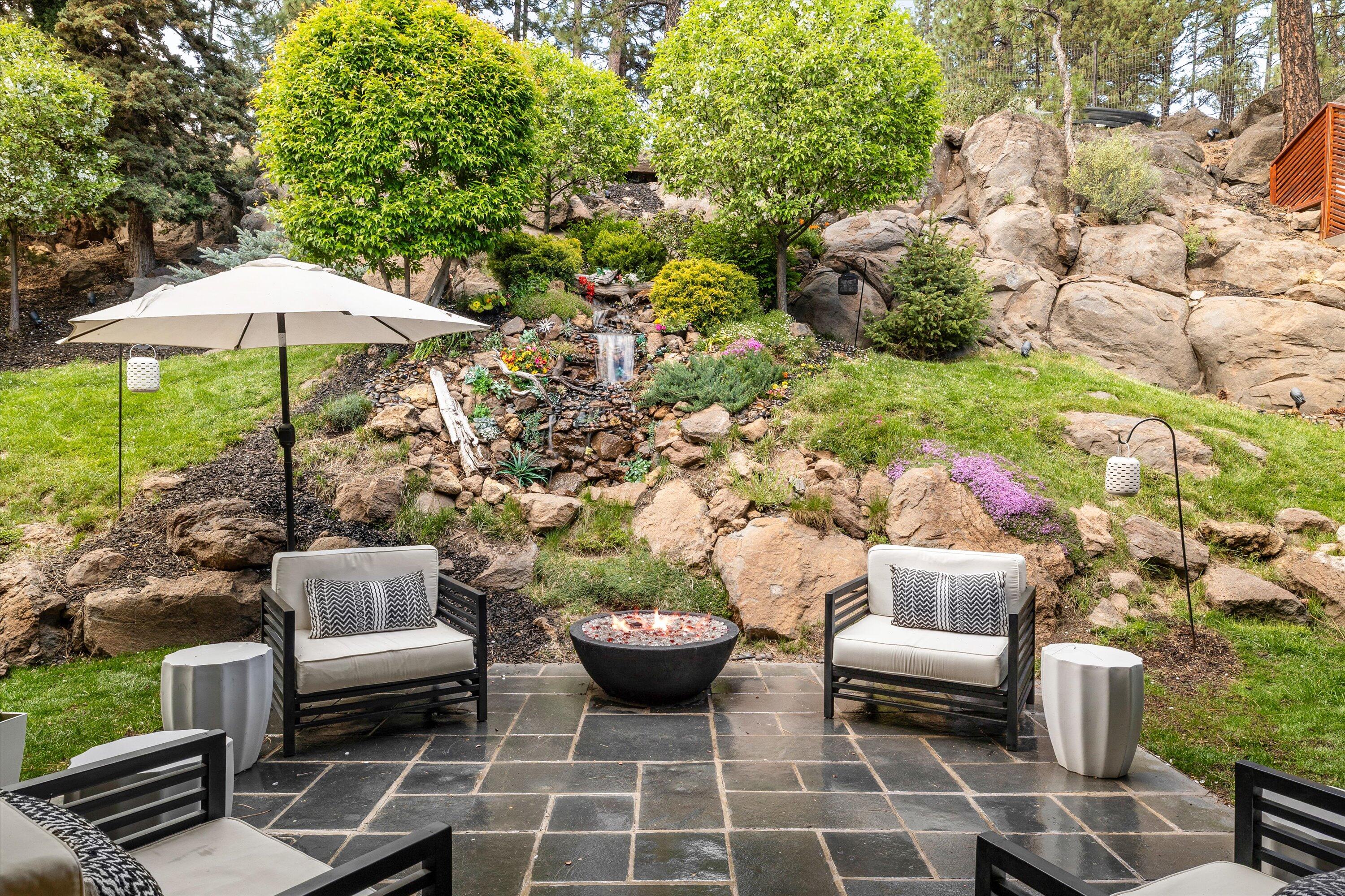19504 Southwest Century Drive Bend, OR 97702 - Photo 39 of 58 a view of a patio with couple of chairs and a fire pit