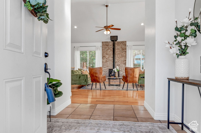 480 East 200 North Mapleton, UT 84664 - Photo 1 of 1 Tiled foyer with ceiling fan, a wood stove, and high vaulted ceiling