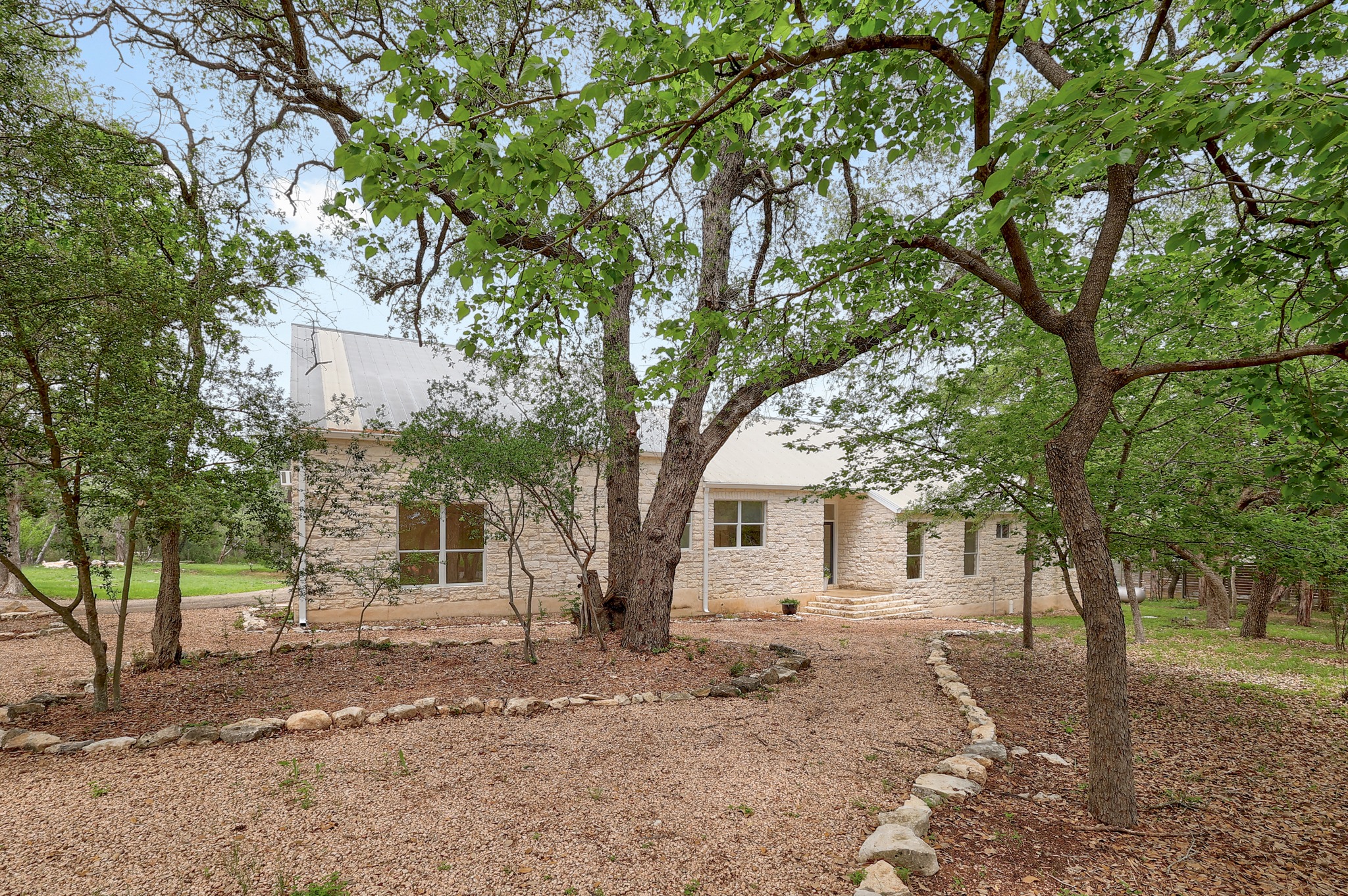 1700 Patterson Road Austin, TX 78733 - Photo 2 of 36 Hill Country stone home in a natural setting