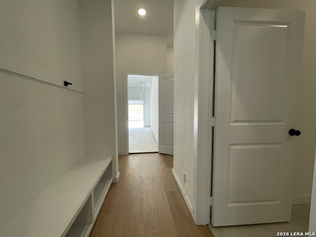 9431 Hidden Stone Schertz, TX 78154 - Photo 17 of 30 a view of a hallway with wooden floor