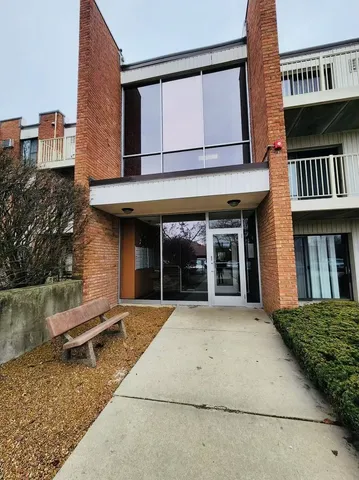 a view of a brick building with many windows