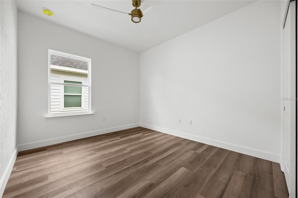 1099 Southwest 66th Terrace Gainesville, FL 32607 - Photo 13 of 35 an empty room with a window