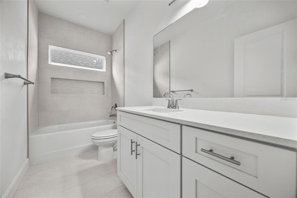 1099 Southwest 66th Terrace Gainesville, FL 32607 - Photo 15 of 35 a bathroom with a sink a toilet and shower