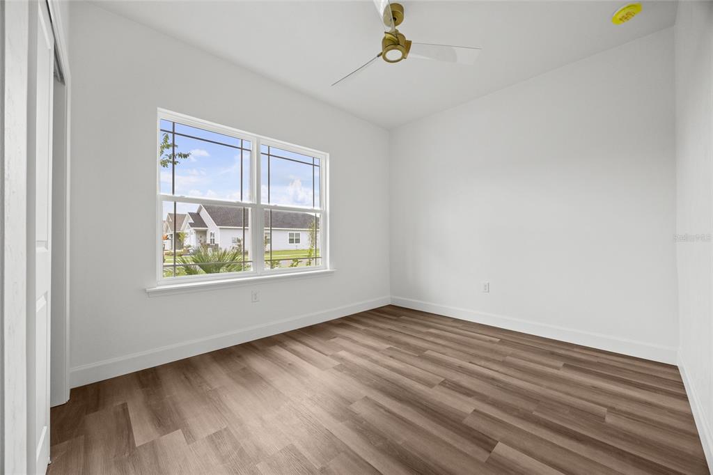 1099 Southwest 66th Terrace Gainesville, FL 32607 - Photo 16 of 35 a view of an empty room with a window