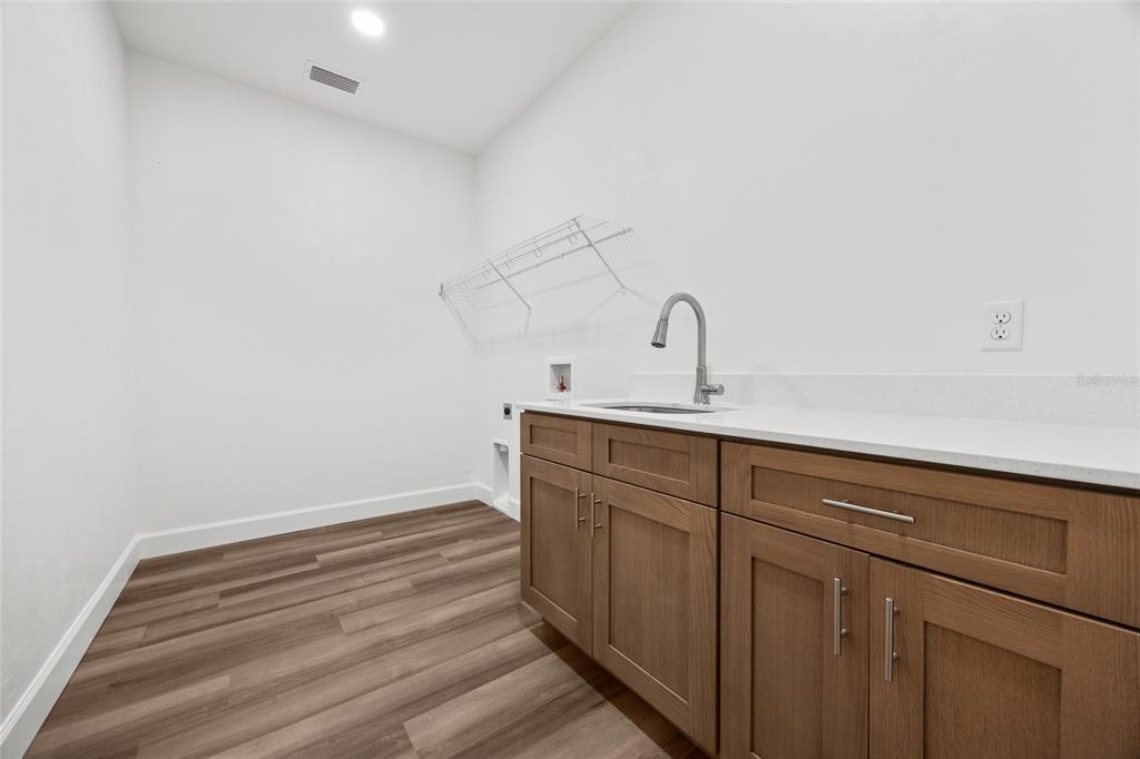 1099 Southwest 66th Terrace Gainesville, FL 32607 - Photo 20 of 35 a bathroom with a sink and vanity