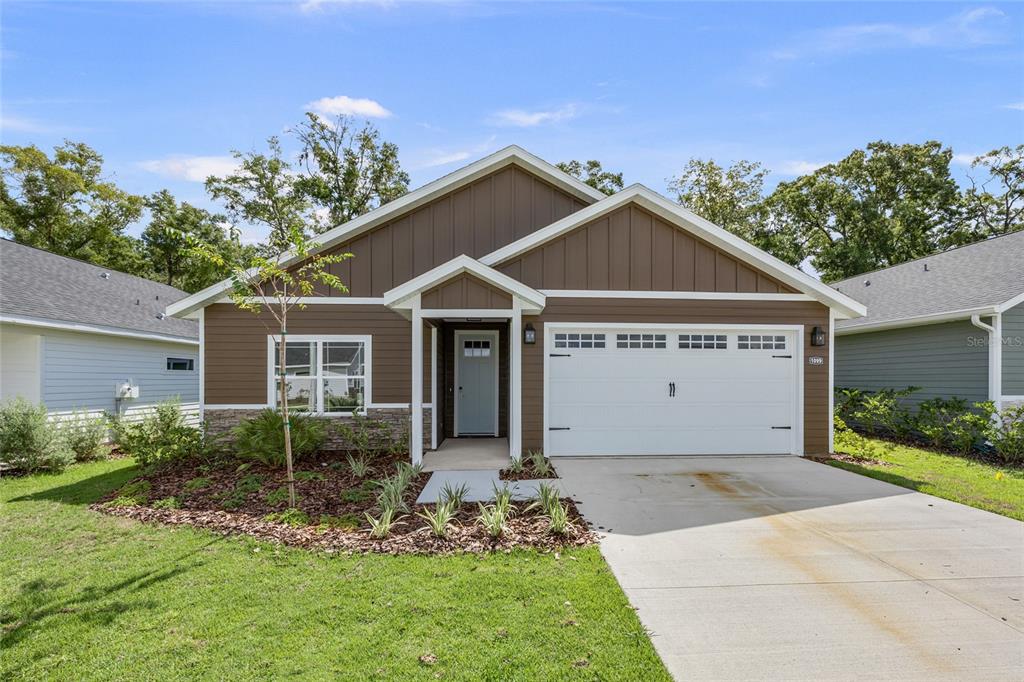 1099 Southwest 66th Terrace Gainesville, FL 32607 - Photo 2 of 35 a view of house with garden