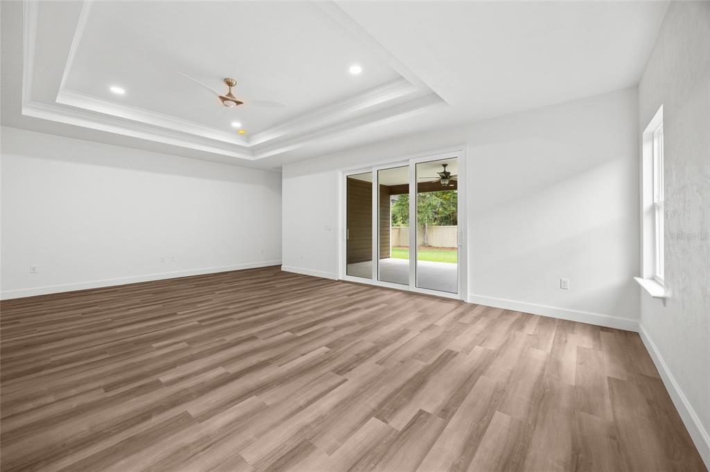 1099 Southwest 66th Terrace Gainesville, FL 32607 - Photo 27 of 35 wooden floor in an empty room with a window