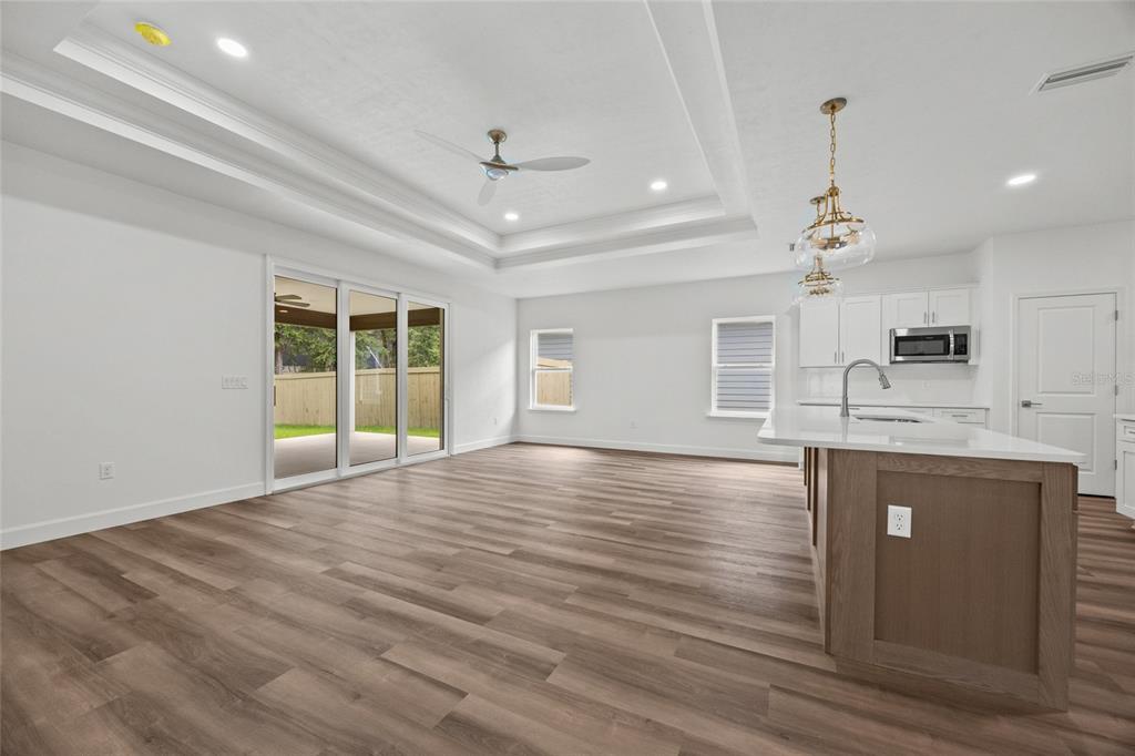 1099 Southwest 66th Terrace Gainesville, FL 32607 - Photo 30 of 35 an empty room with wooden floor and windows