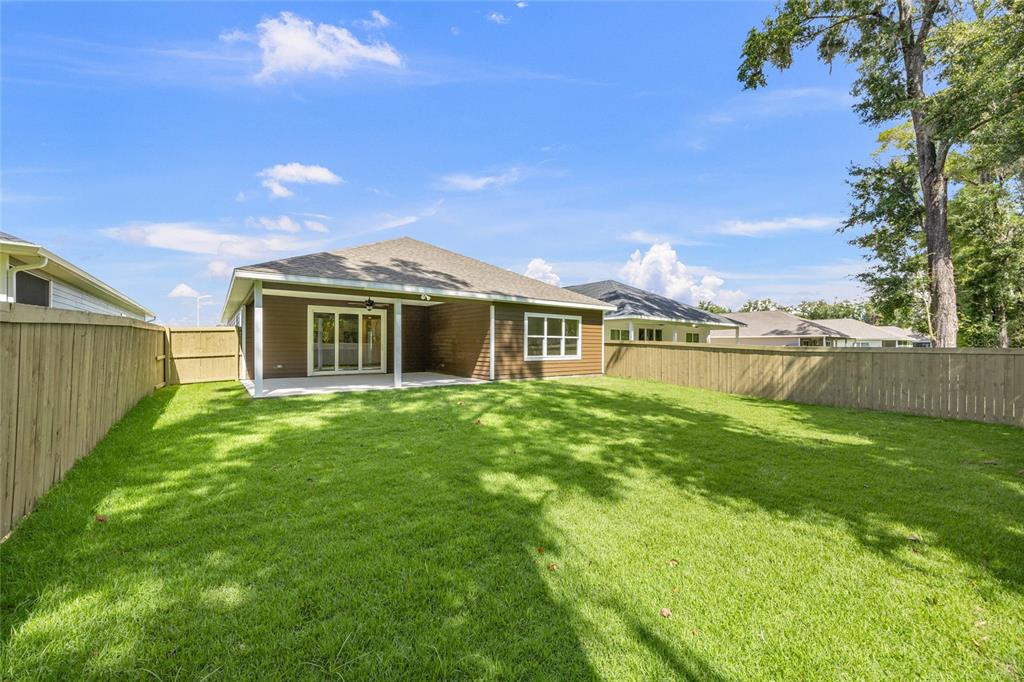 1099 Southwest 66th Terrace Gainesville, FL 32607 - Photo 6 of 35 a front view of a house with a yard