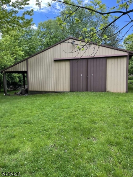 619 Foothill Road Bridgewater, NJ 08807 - Photo 7 of 23 a view of a backyard with a barn and a cactus plant