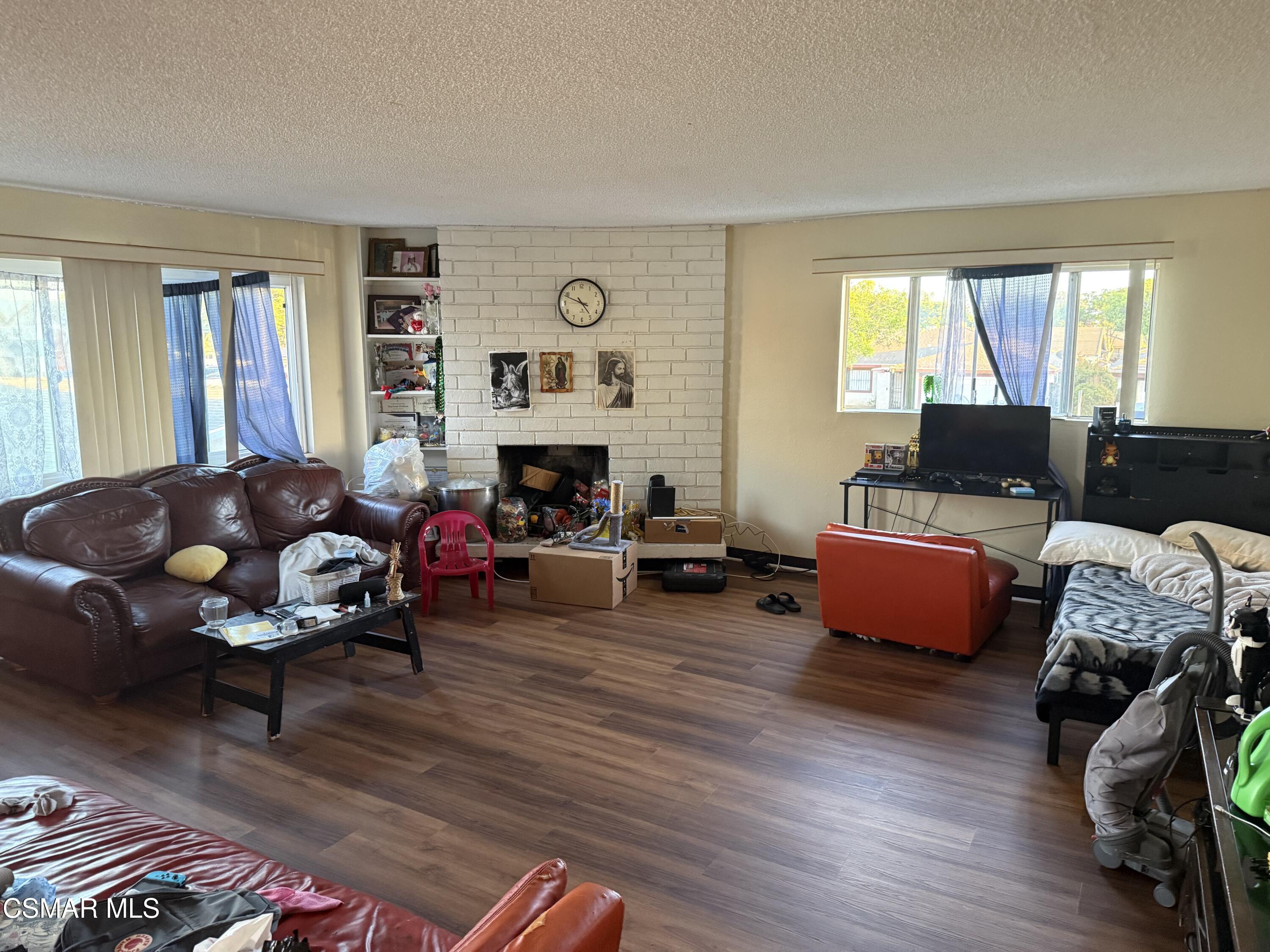 331 Campbell Way Oxnard, CA 93033 - Photo 5 of 14 a living room with furniture and a fireplace