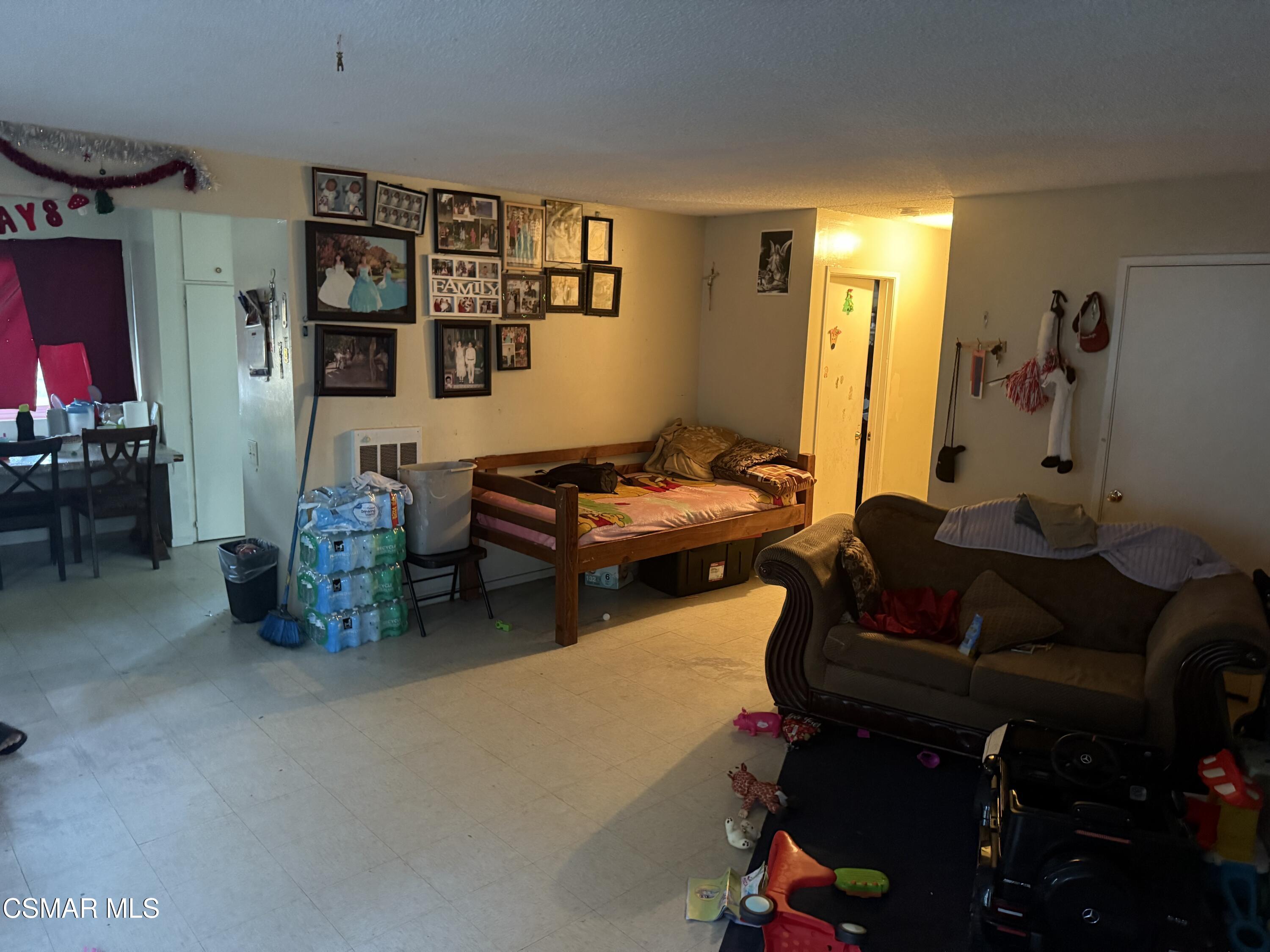 331 Campbell Way Oxnard, CA 93033 - Photo 7 of 14 a living room with furniture and gym equipment