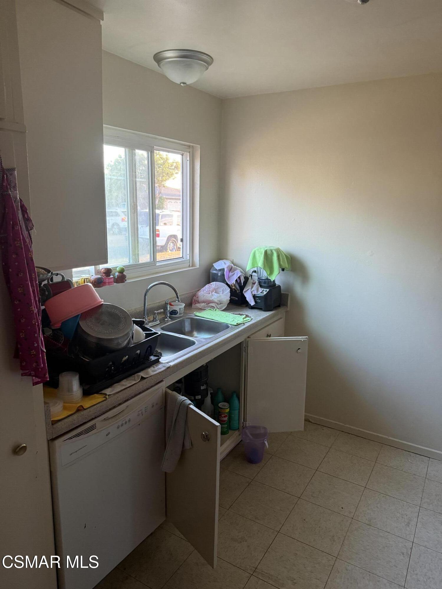 331 Campbell Way Oxnard, CA 93033 - Photo 8 of 14 a storage room with washer and window