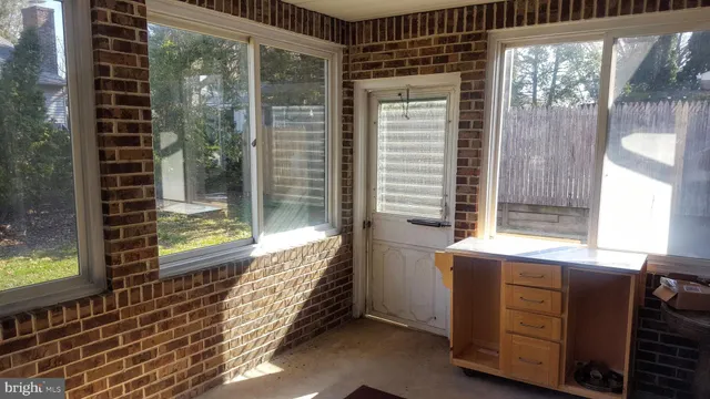 a view of a balcony with yard