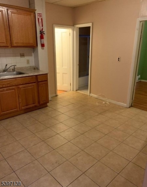 76 Jasper Street Paterson, NJ 07522 - Photo 8 of 12 a view of a kitchen with a sink