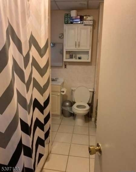 76 Jasper Street Paterson, NJ 07522 - Photo 10 of 12 a bathroom with a sink and toilet