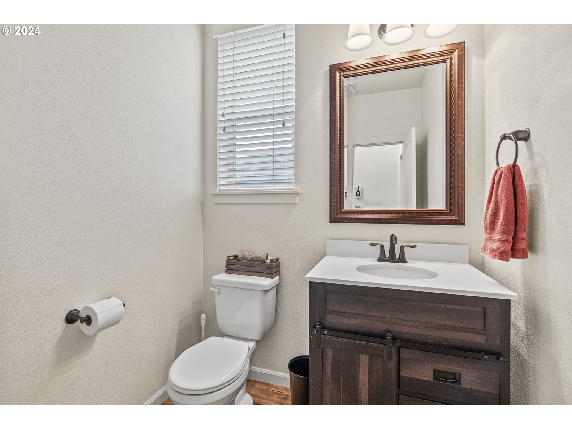 266 North Green Gables Loop Ridgefield, WA 98642 - Photo 7 of 37 a bathroom with a toilet sink and mirror