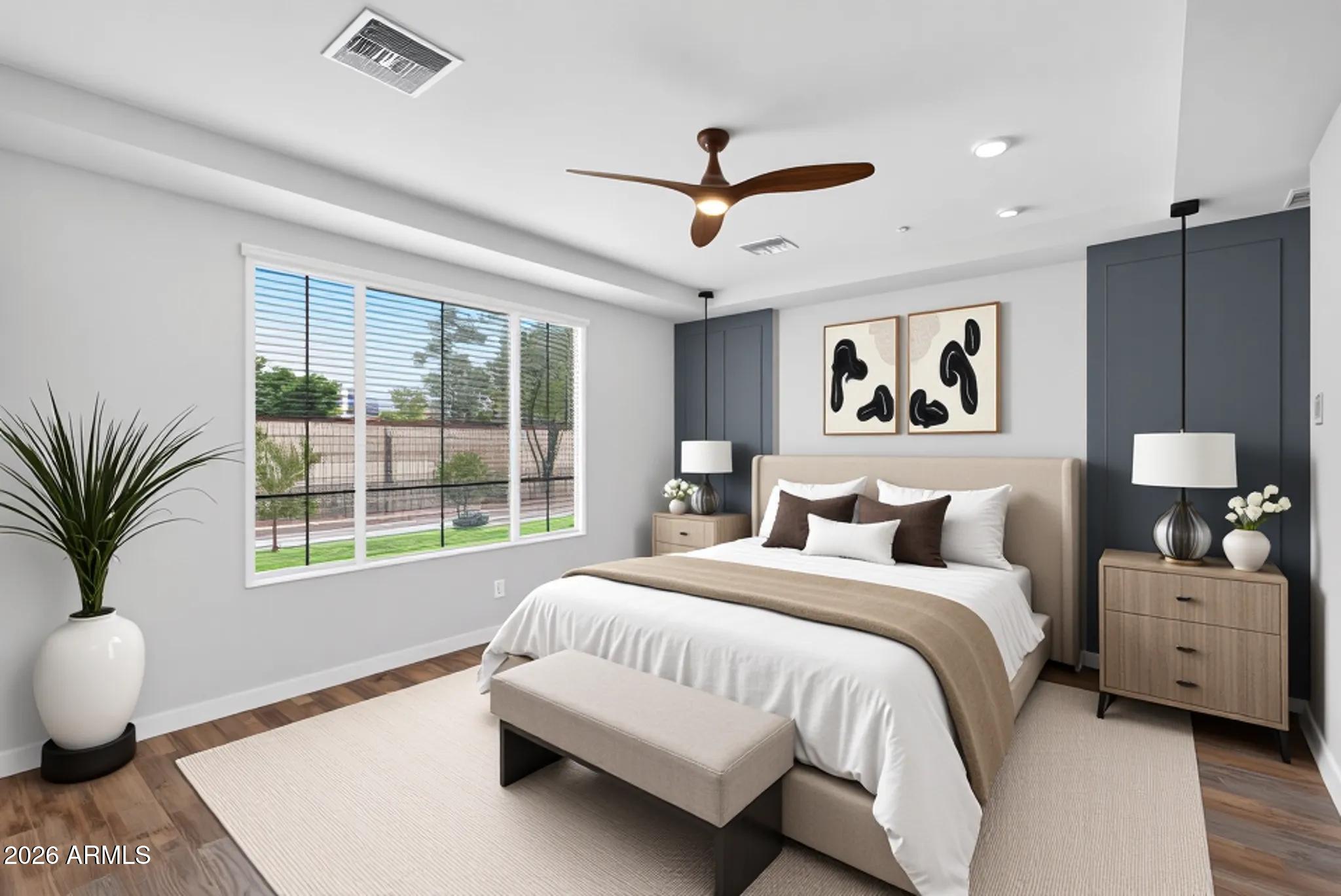 12124 West Peak View Road Peoria, AZ 85383 - Photo 17 of 38 a bedroom with a large bed and a window