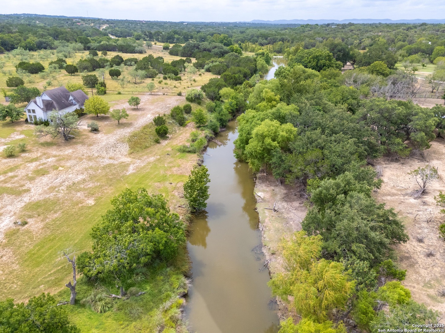 369 Deer Valley Bandera, TX 78003 - Photo 1 of 34 a view of a lake with houses