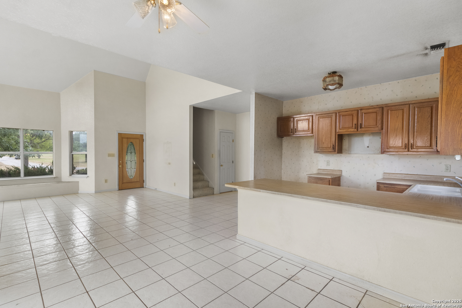 369 Deer Valley Bandera, TX 78003 - Photo 24 of 34 a kitchen with granite countertop a sink and a stove top oven