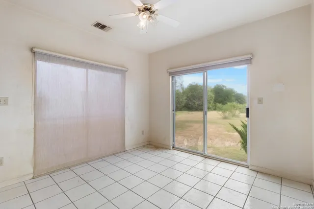 a view of an empty room and window