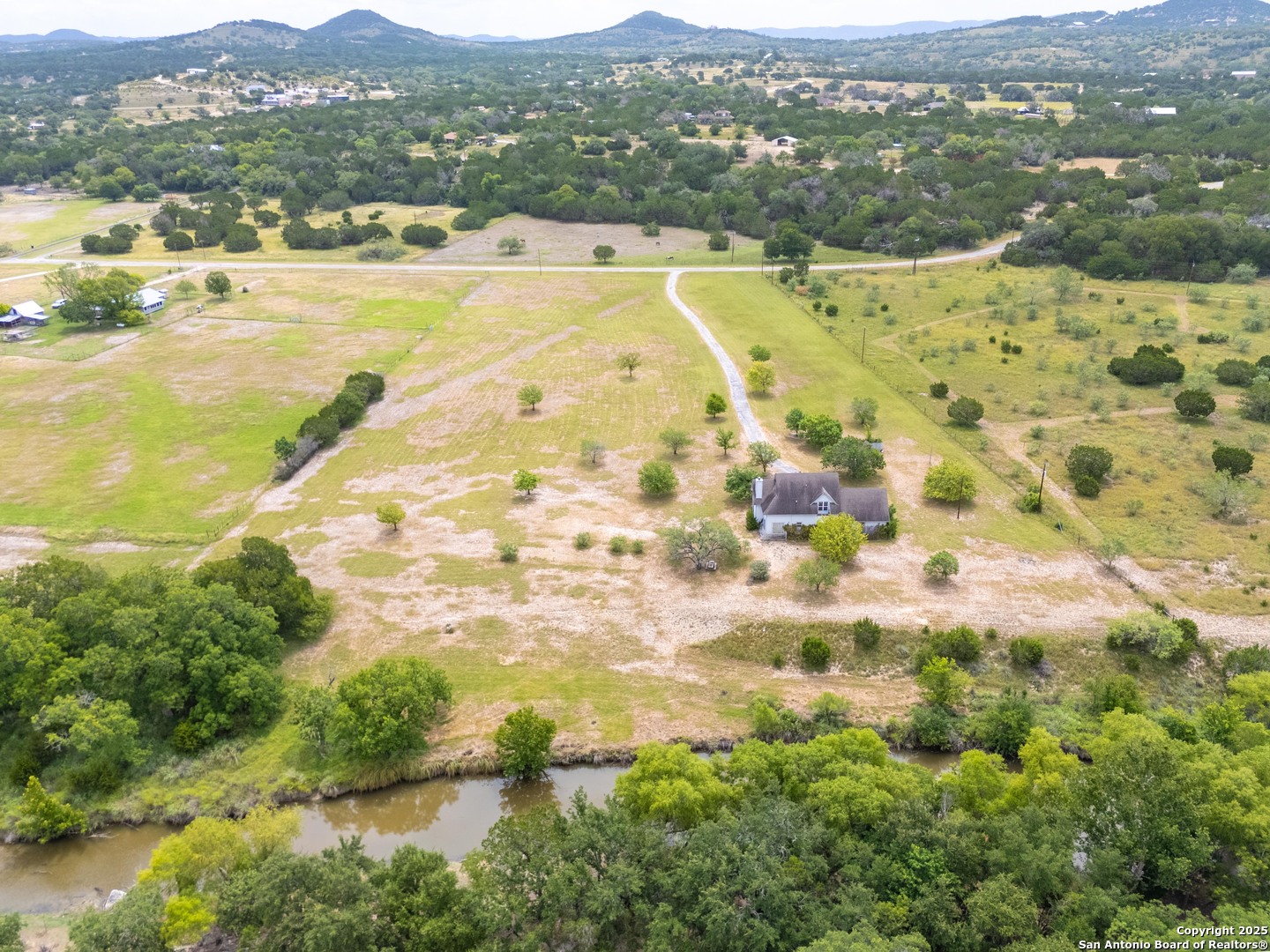 369 Deer Valley Bandera, TX 78003 - Photo 29 of 34 a view of an aerial view of residential houses with outdoor space and trees