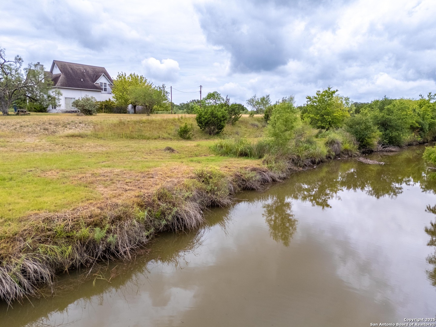 369 Deer Valley Bandera, TX 78003 - Photo 34 of 34 a view of a lake with houses in the background