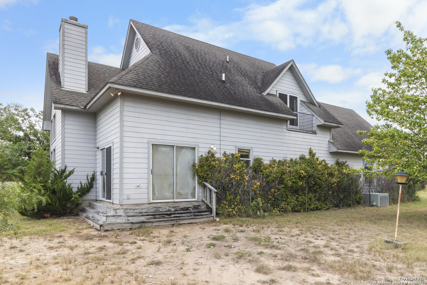 369 Deer Valley Bandera, TX 78003 - Photo 6 of 34 a view of a house with a yard and potted plants