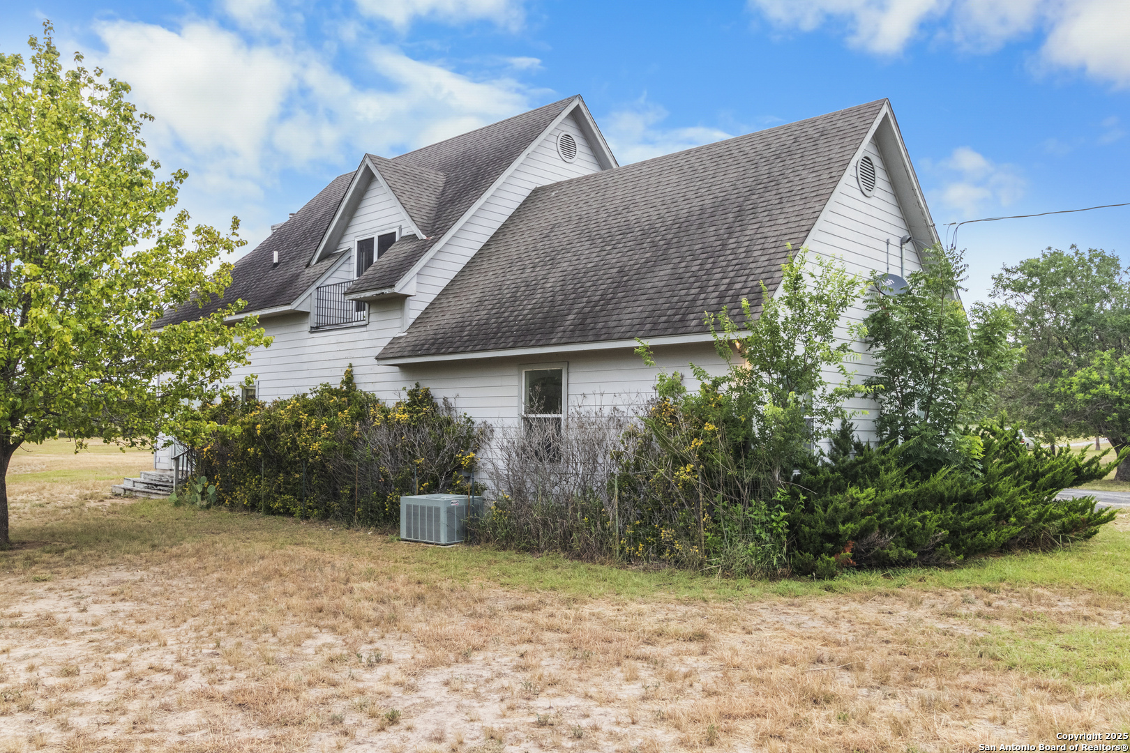 369 Deer Valley Bandera, TX 78003 - Photo 7 of 34 a view of a house with a yard and plants