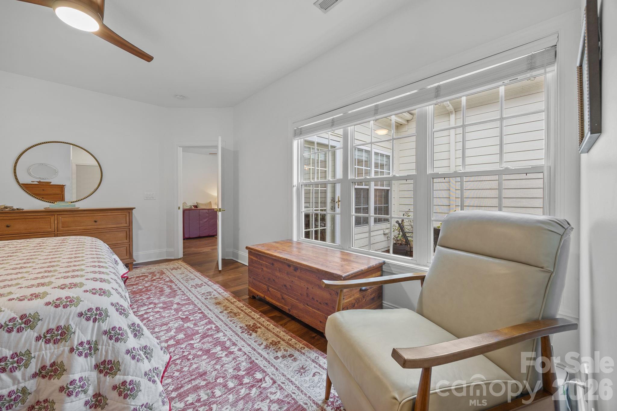 233 Twain Avenue Davidson, NC 28036 - Photo 16 of 35 a bedroom with a bed and glass window