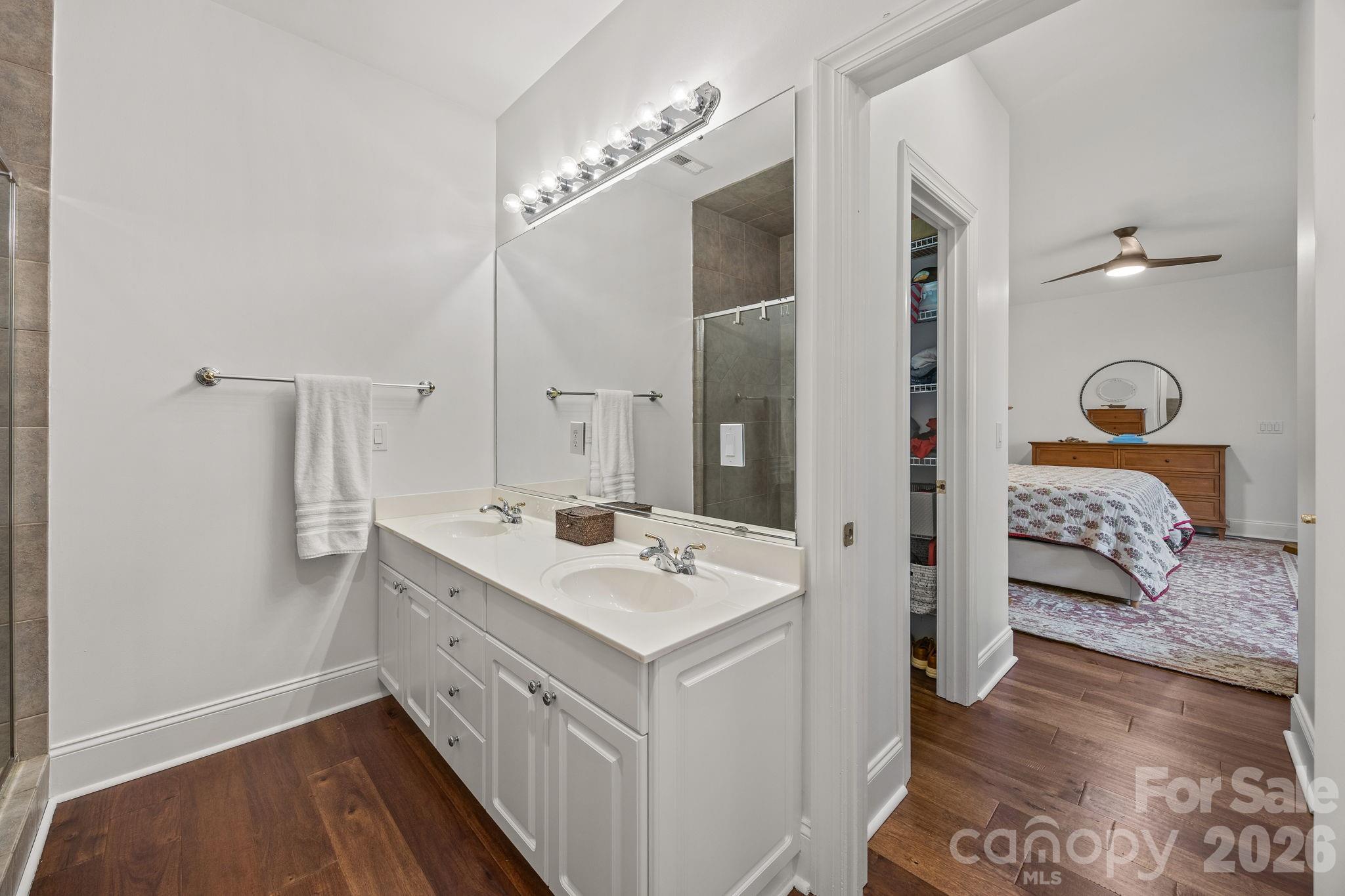 233 Twain Avenue Davidson, NC 28036 - Photo 17 of 35 a en suite bathroom with a sink and a mirror