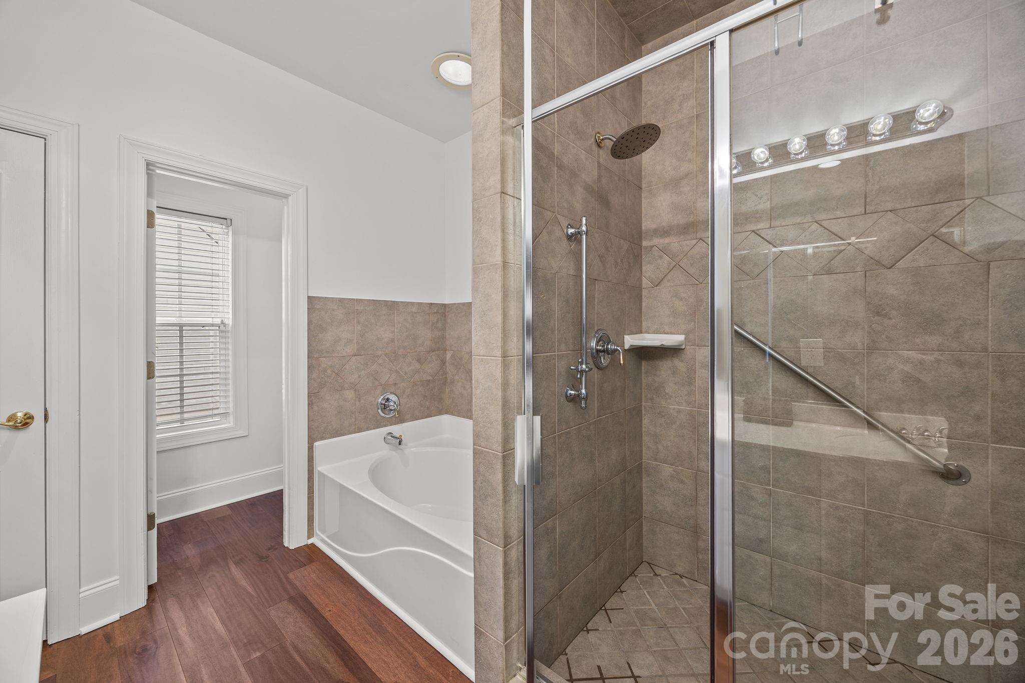 233 Twain Avenue Davidson, NC 28036 - Photo 18 of 35 a bathroom with a bathtub and a shower