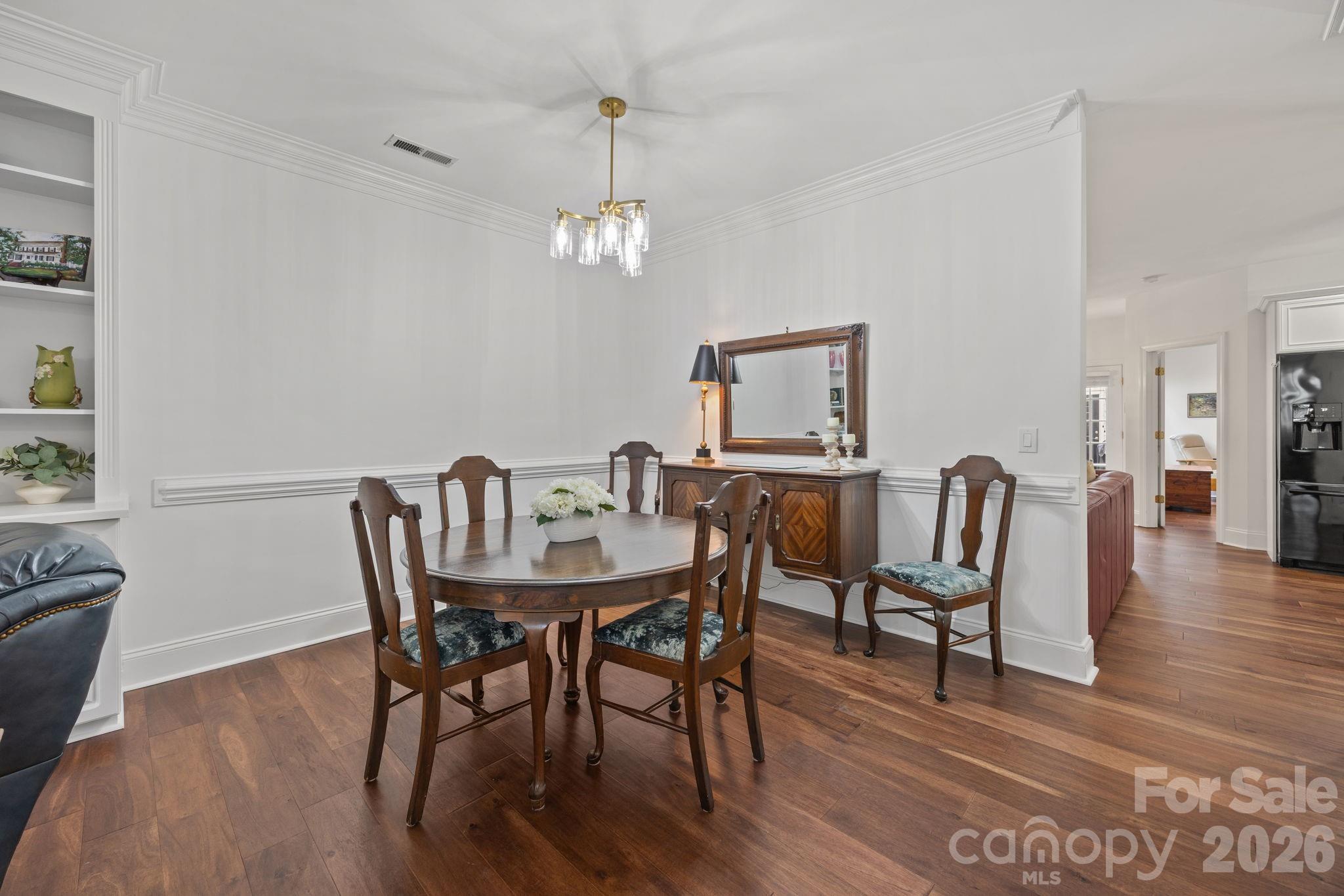 233 Twain Avenue Davidson, NC 28036 - Photo 5 of 35 a view of a dining room with furniture wooden floor and chandelier