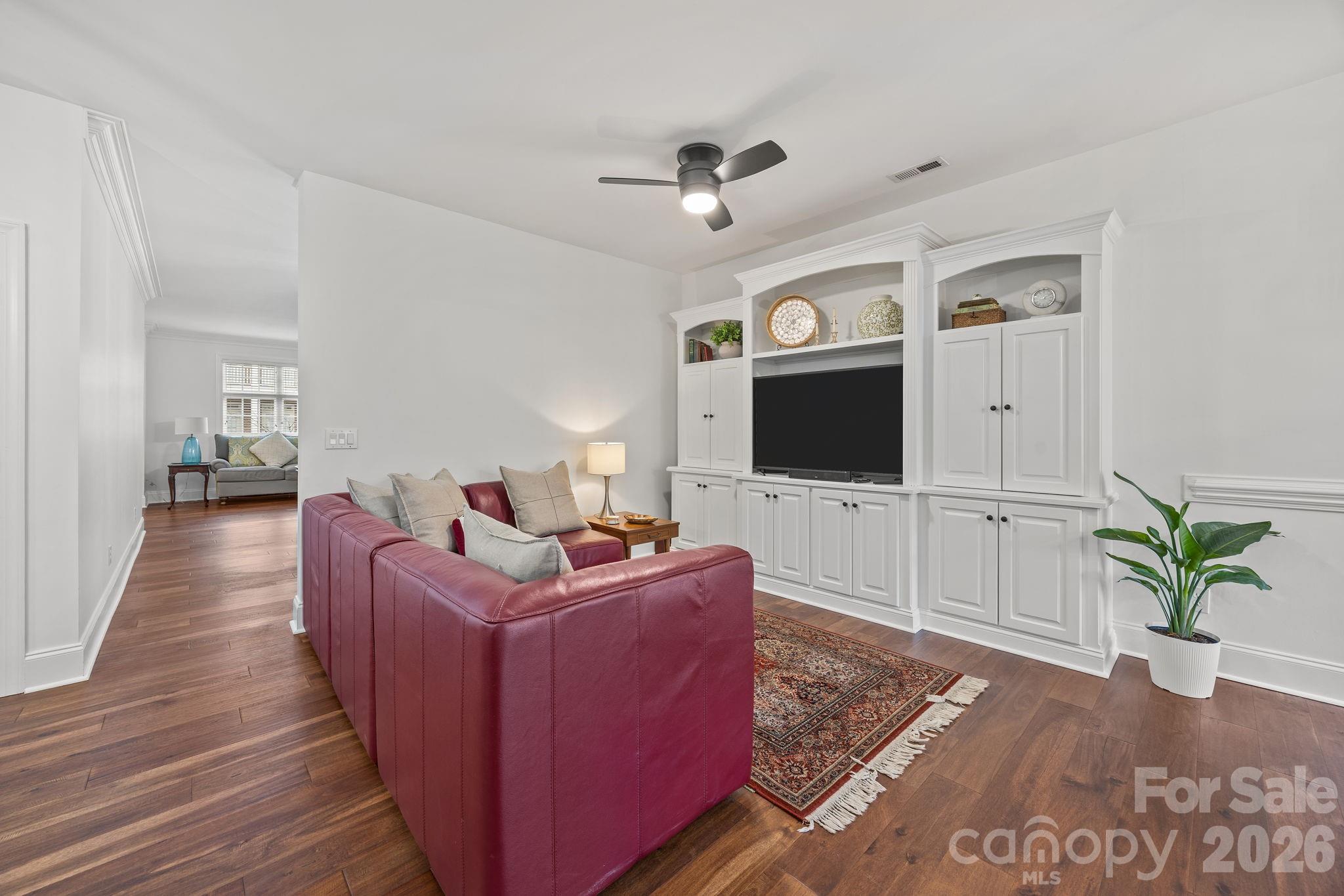 233 Twain Avenue Davidson, NC 28036 - Photo 7 of 35 a living room with furniture and a flat screen tv