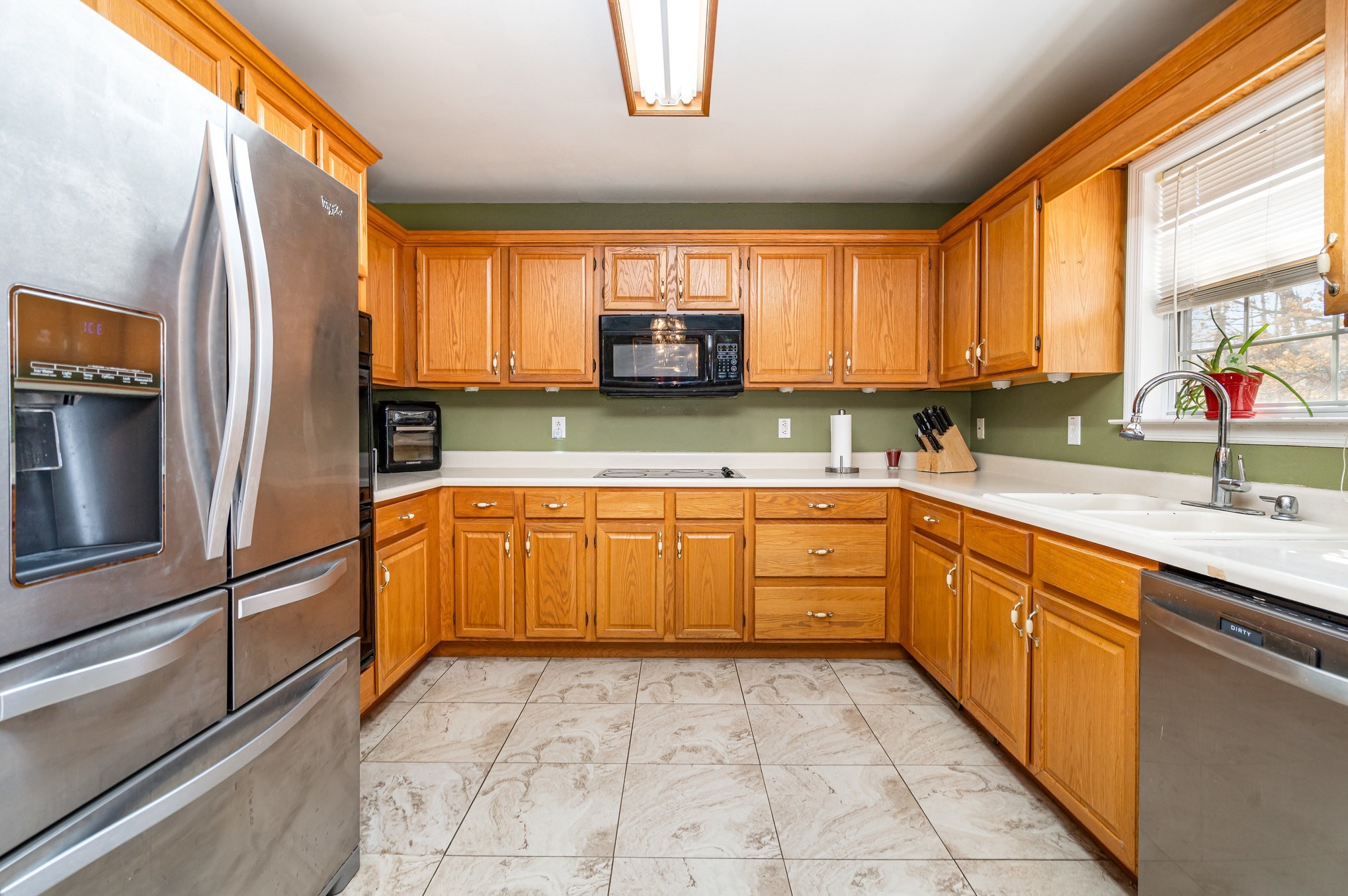 5221 Grand View Lane Pleasant View, TN 37146 - Photo 14 of 37 a kitchen with a refrigerator sink and a large window