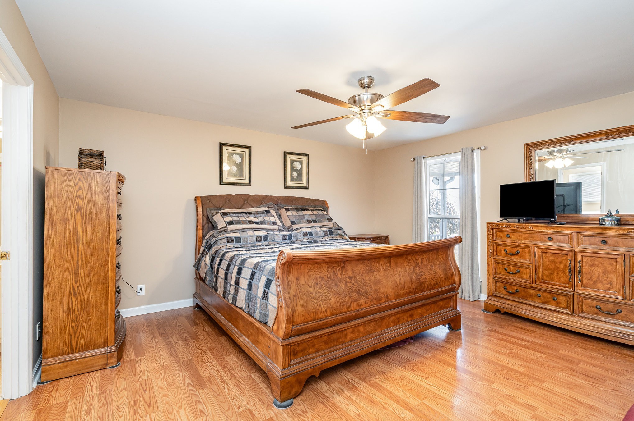 5221 Grand View Lane Pleasant View, TN 37146 - Photo 15 of 37 a bedroom with a bed and a flat screen tv