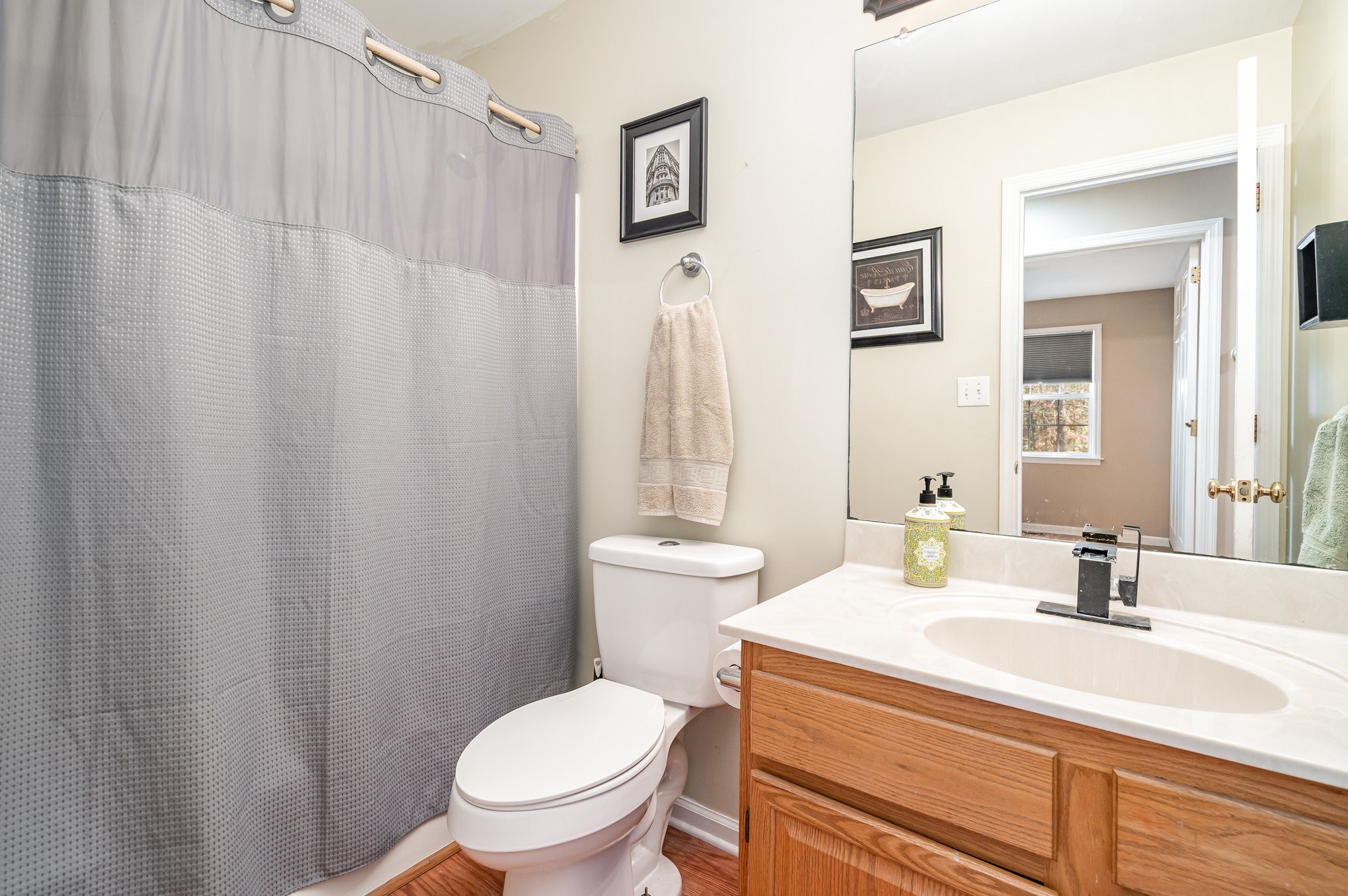 5221 Grand View Lane Pleasant View, TN 37146 - Photo 21 of 37 a bathroom with a sink a toilet and shower curtain
