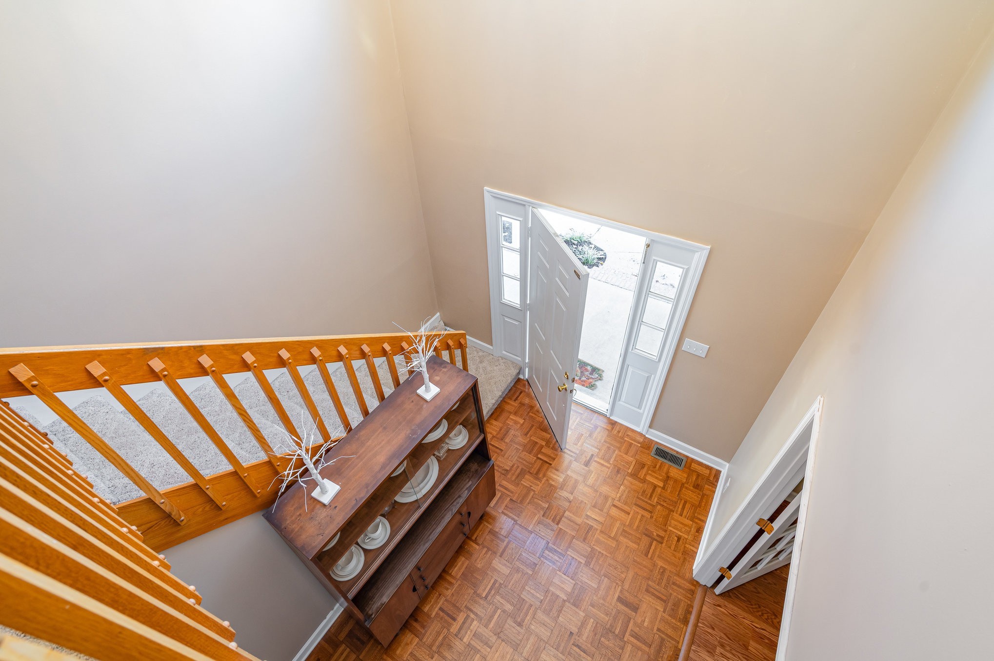 5221 Grand View Lane Pleasant View, TN 37146 - Photo 22 of 37 a view of an empty room with wooden floor and furniture