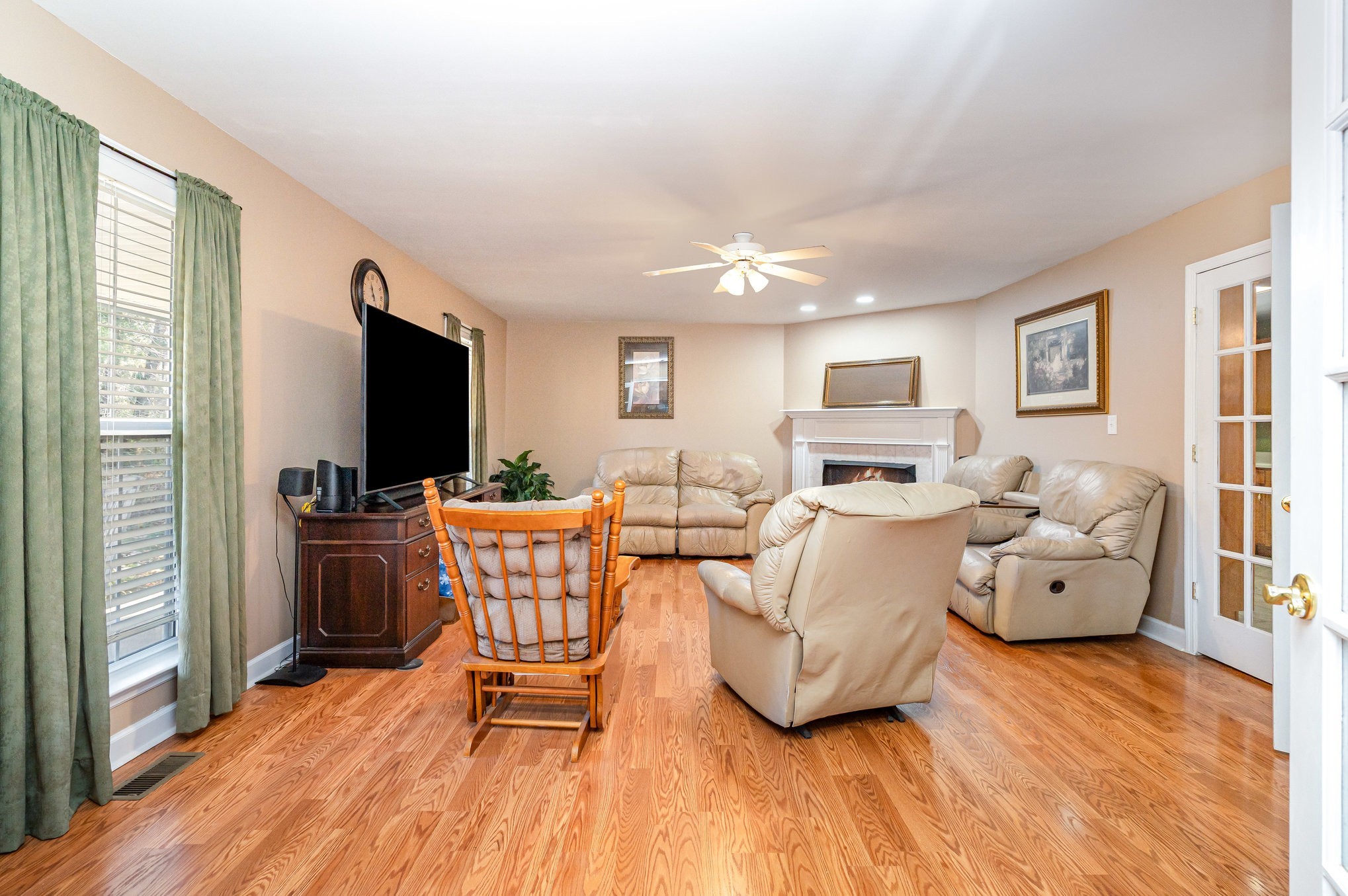 5221 Grand View Lane Pleasant View, TN 37146 - Photo 10 of 37 a living room with furniture a flat screen tv and kitchen view