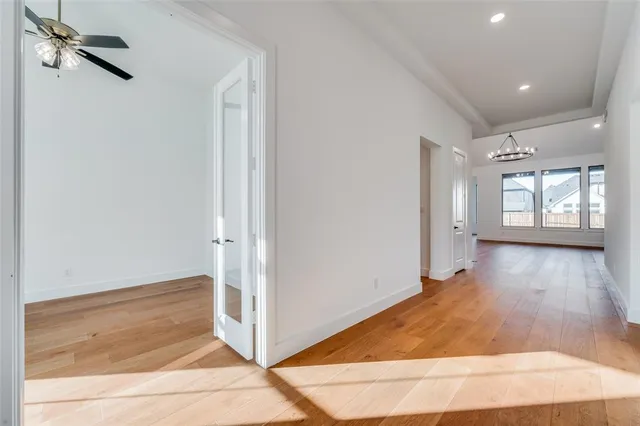 an entryway in a hall with a window