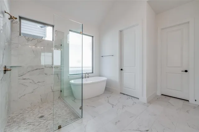a spacious bathroom with a bathtub and toilet