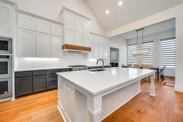 a kitchen with a sink and cabinets