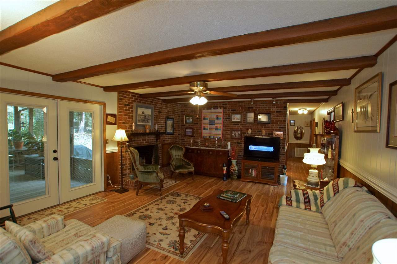 9449 Ferrell Road Zebulon, NC 27597 - Photo 5 of 28 Perfect setting for the family. French doors provides entry to Screen Porch. Family Room