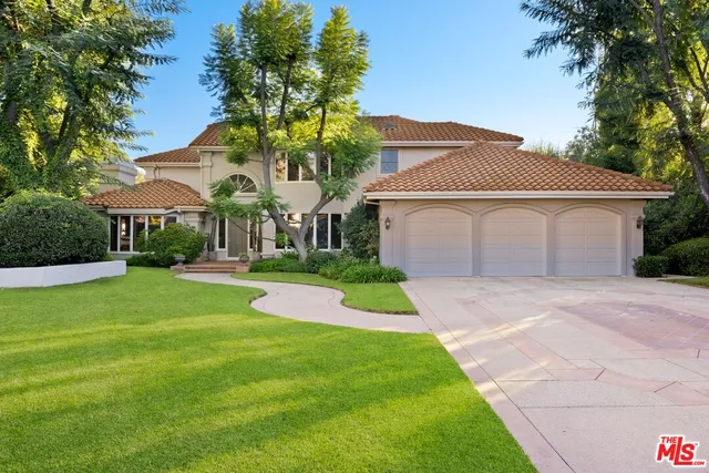 a view of a livingroom with furniture and a potted plant