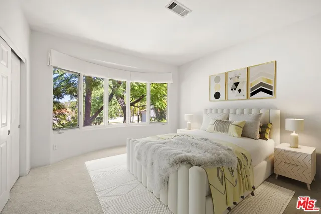 a spacious bathroom with a granite countertop tub shower and sink